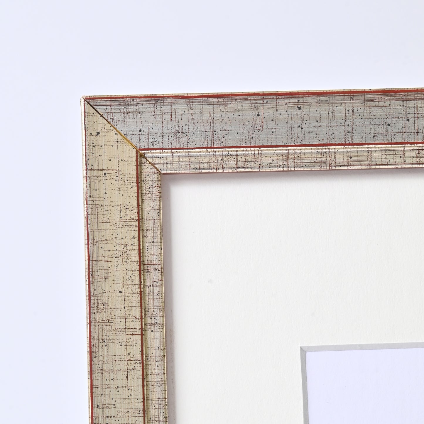 1" Wide Brushed Silver Foil With Distressed Red Undertones On Angled Profile