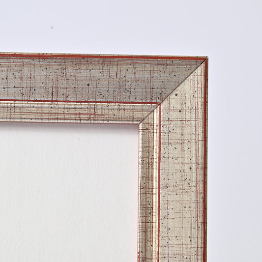 1" Wide Brushed Silver Foil With Distressed Red Undertones On Angled Profile