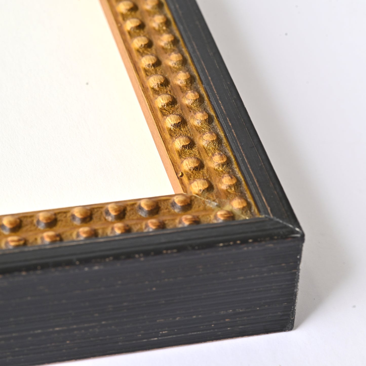 7/8” Burnished Black And Gold Finish On Beaded Profile