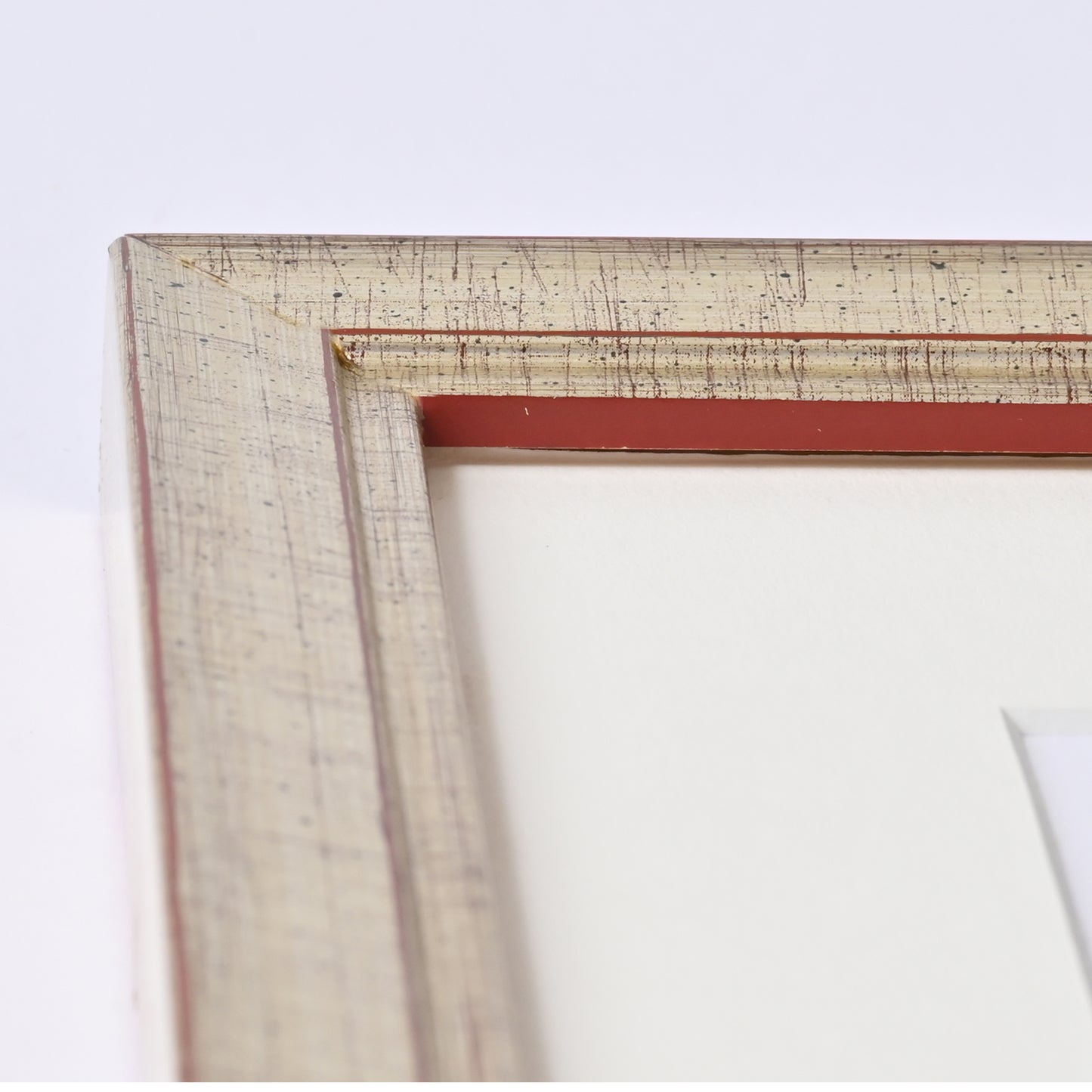 1" Wide Brushed Silver Foil With Distressed Red Undertones On Angled Profile
