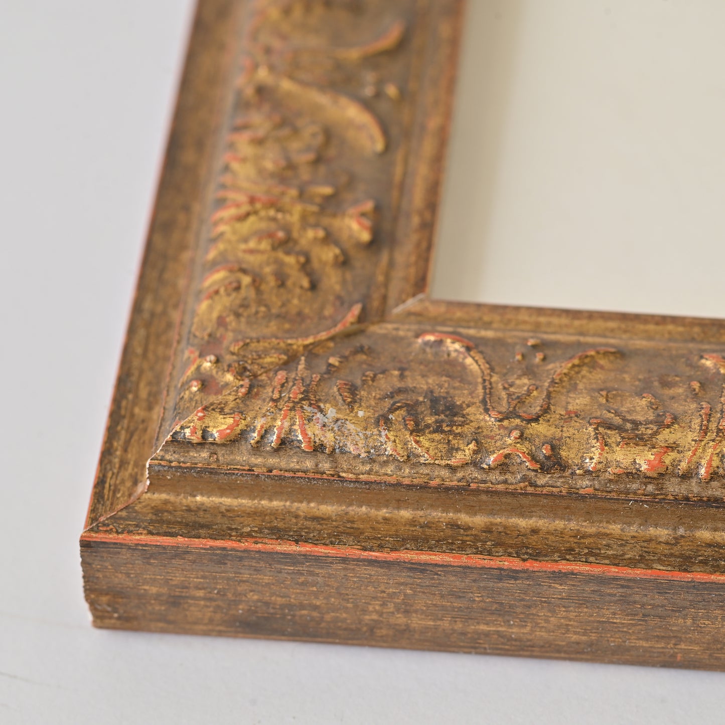 Antique Gold Finish Frame With Red And Black Undertones On Ornate Profile