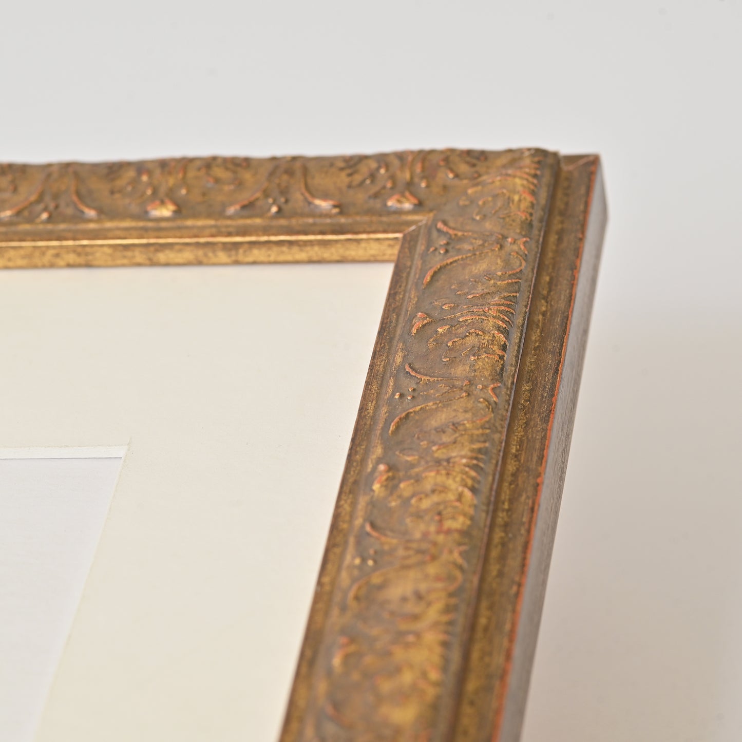 Antique Gold Finish Frame With Red And Black Undertones On Ornate Profile