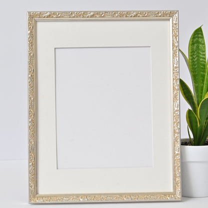 Ornate Bright Silver Gilded Frame On Ornate Motif Pattern