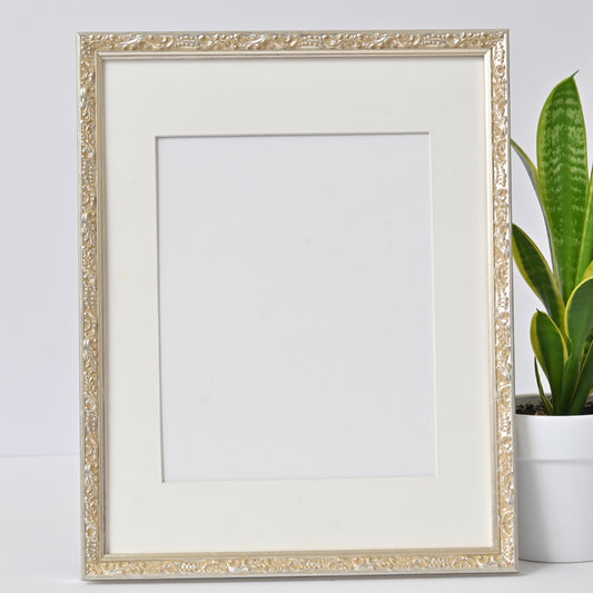 Ornate Bright Silver Gilded Frame On Ornate Motif Pattern