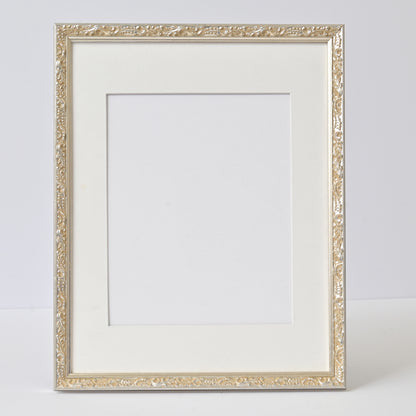 Ornate Bright Silver Gilded Frame On Ornate Motif Pattern