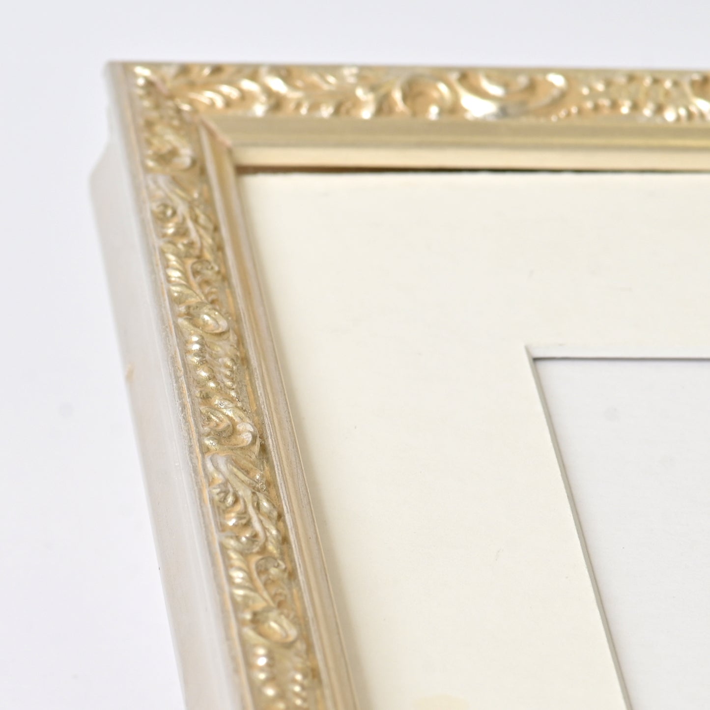 Ornate Bright Silver Gilded Frame On Ornate Motif Pattern