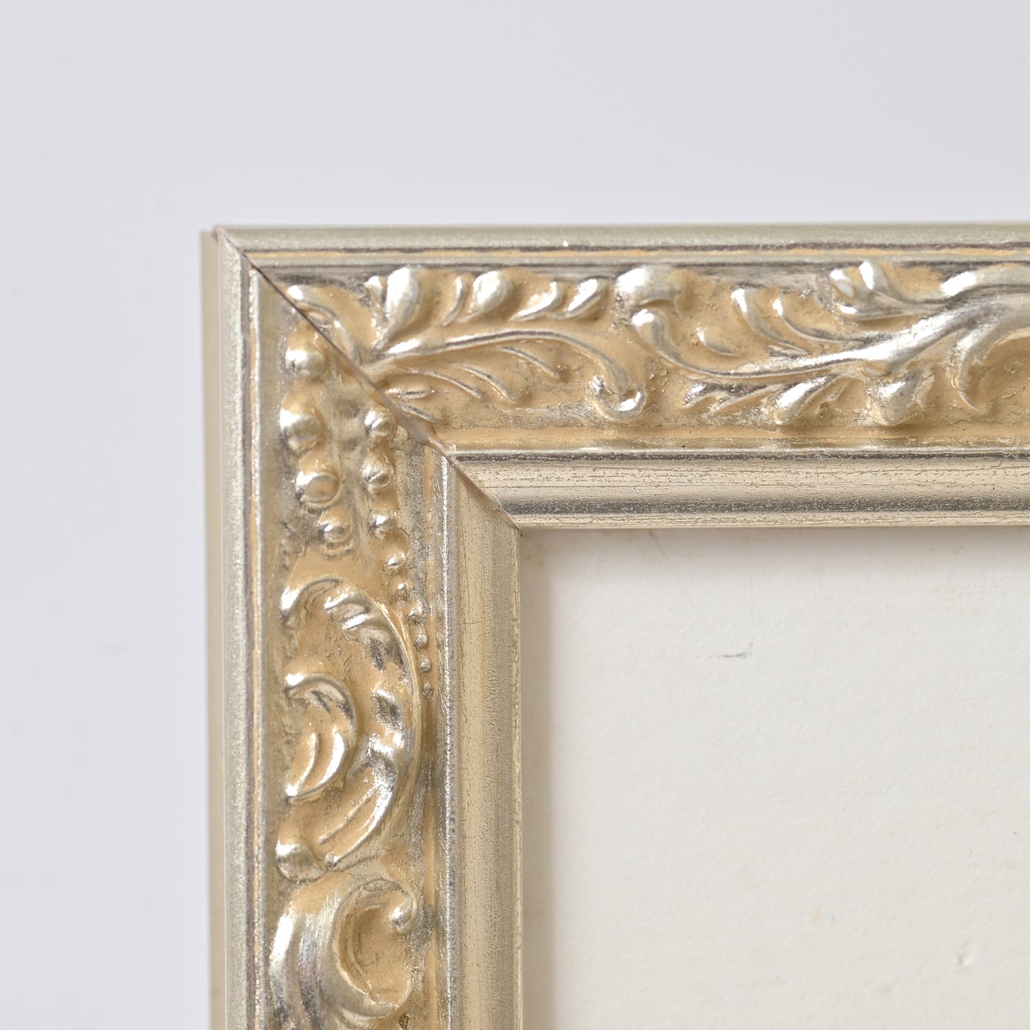 Ornate Bright Silver Gilded Frame On Ornate Motif Pattern