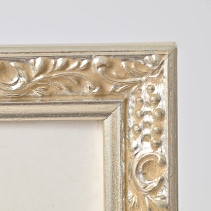 Ornate Bright Silver Gilded Frame On Ornate Motif Pattern