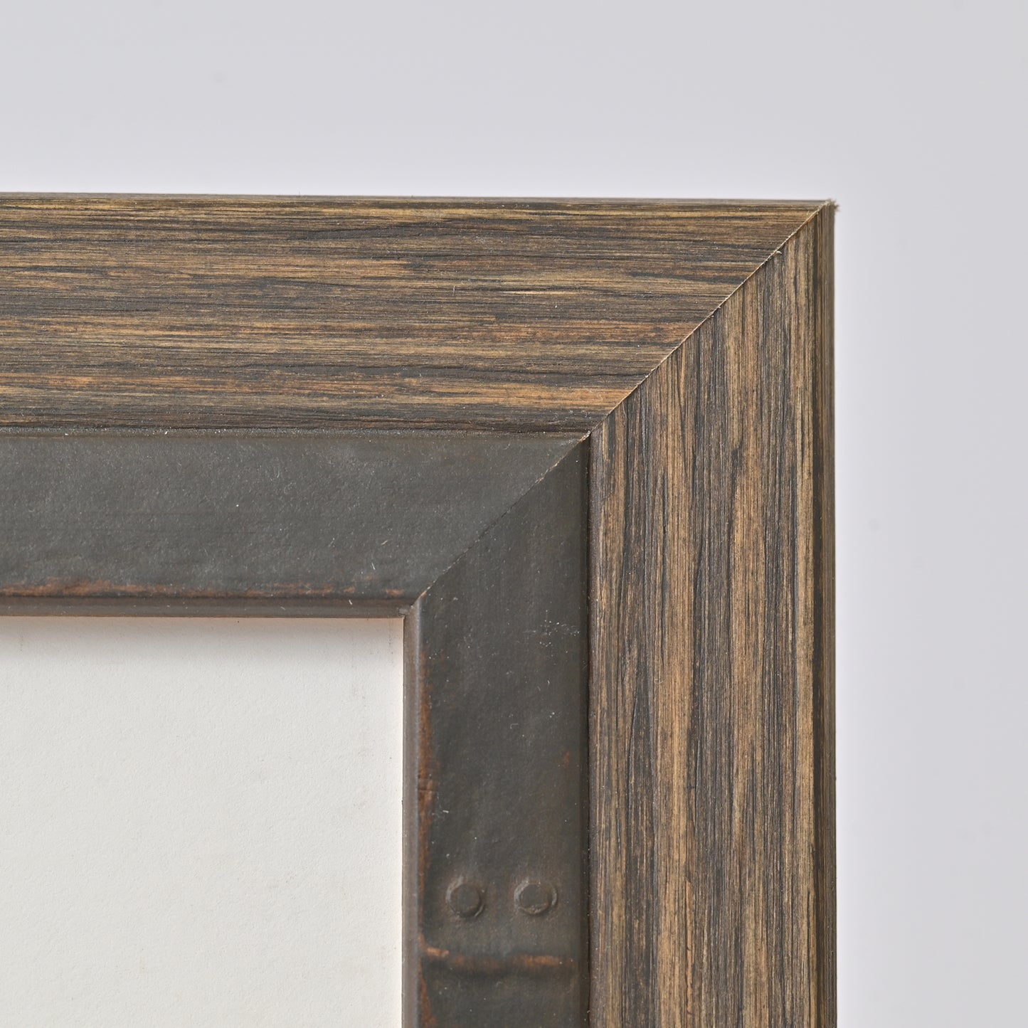 Angled Profile Frame With Iron-Colored Rivet Design on Stained Pine Veneer