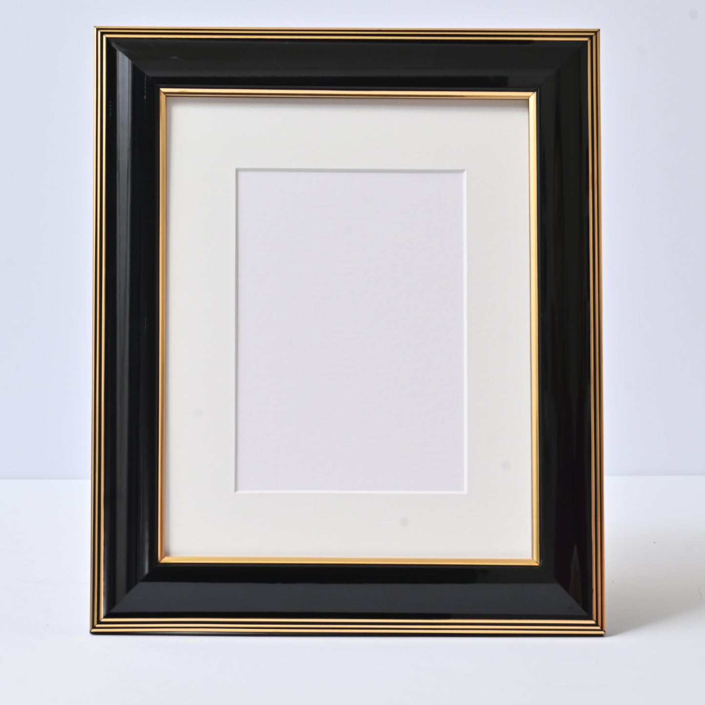 Glossy Black Finish With Gold Lines On A Classic Rounded Profile