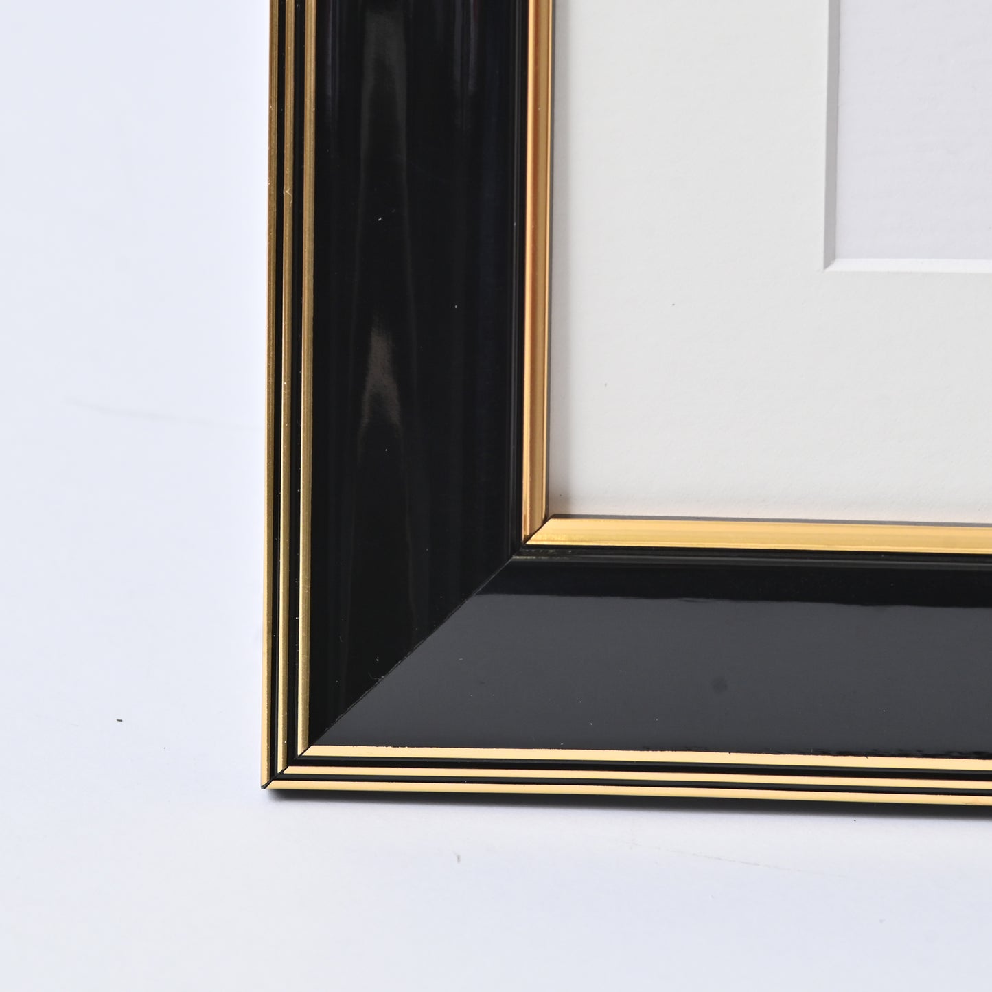 Glossy Black Finish With Gold Lines On A Classic Rounded Profile