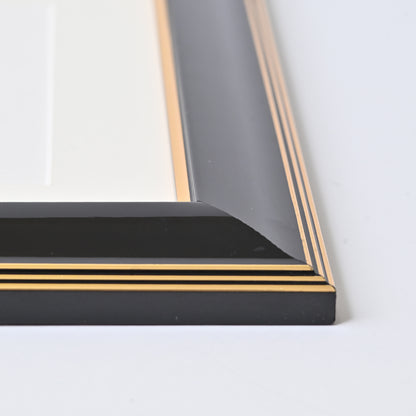 Glossy Black Finish With Gold Lines On A Classic Rounded Profile