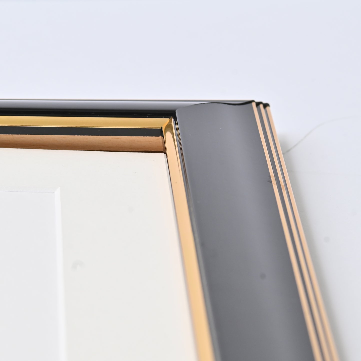 Glossy Black Finish With Gold Lines On A Classic Rounded Profile