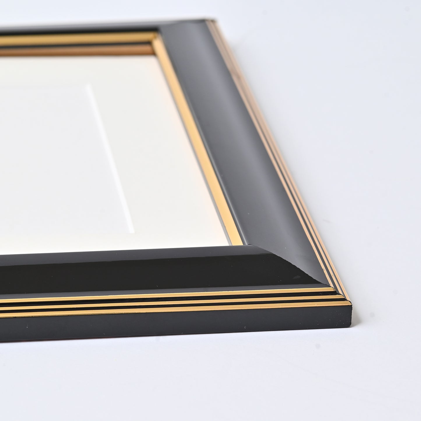 Glossy Black Finish With Gold Lines On A Classic Rounded Profile