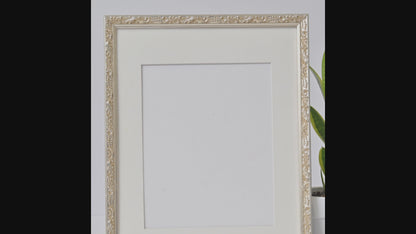 Ornate Bright Silver Gilded Frame On Ornate Motif Pattern